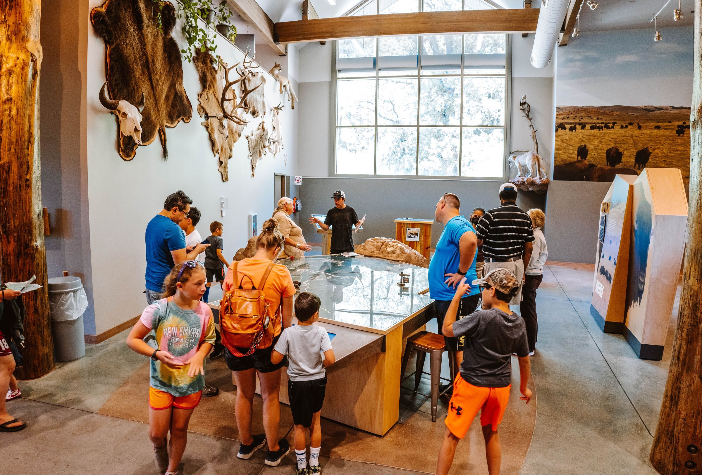 Group of people looking at display in visitor center