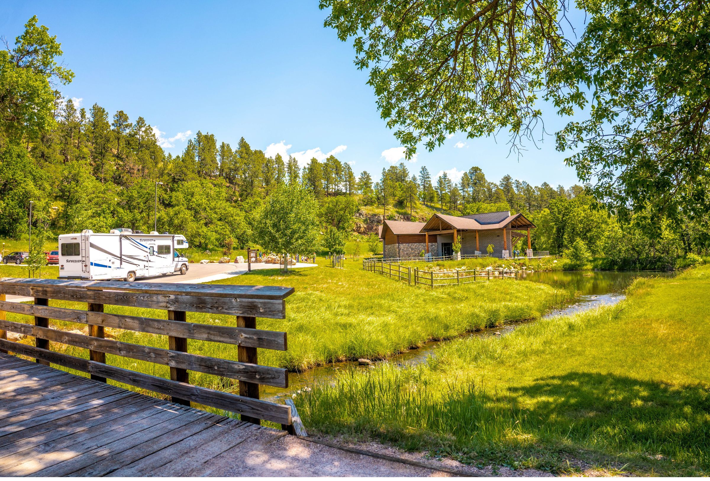 Green field and stream outside of the visitor center