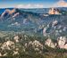 Aerial shot of mountains with Crazy Horse in the background