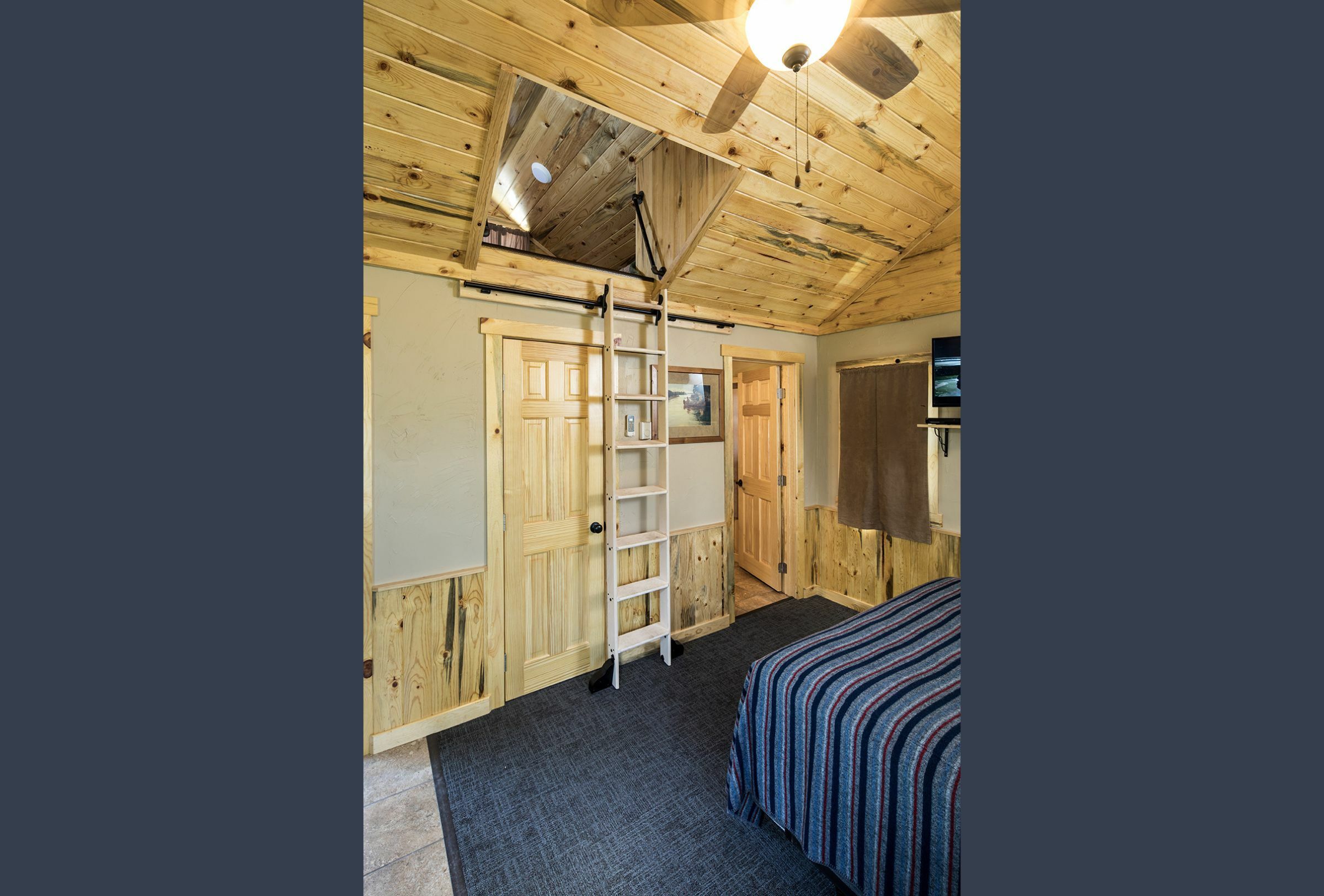 A ladder heads up to a loft within a cabin at Legion Lake in Custer State Park
