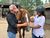 Woman petting a brown horse at equestrian ranch