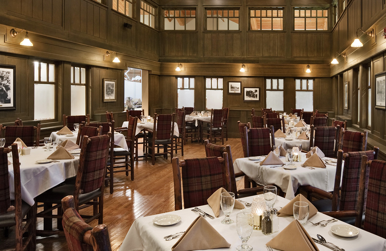 Tables set up neatly in the dining area at State Game Lodge