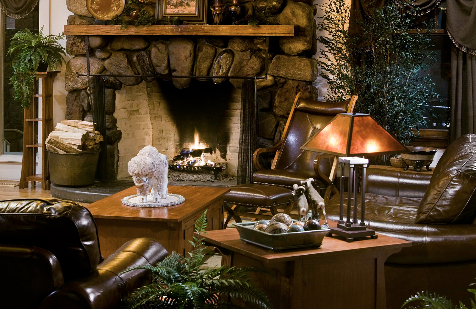 Fireplace in the living room at State Game Lodge
